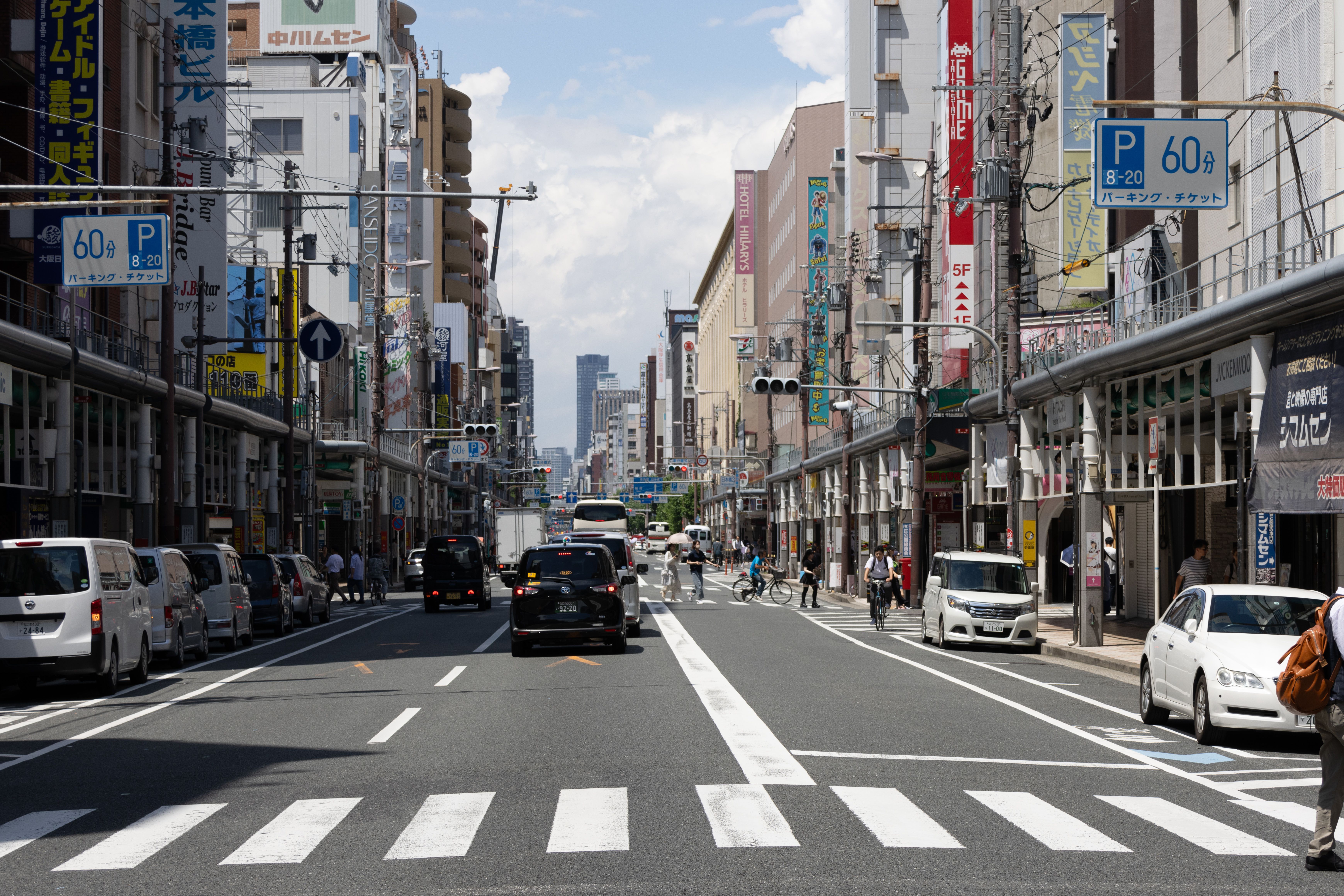 The Den Den Town streetscape in Nipponbashi, Osaka, lined with anime and electronics shops