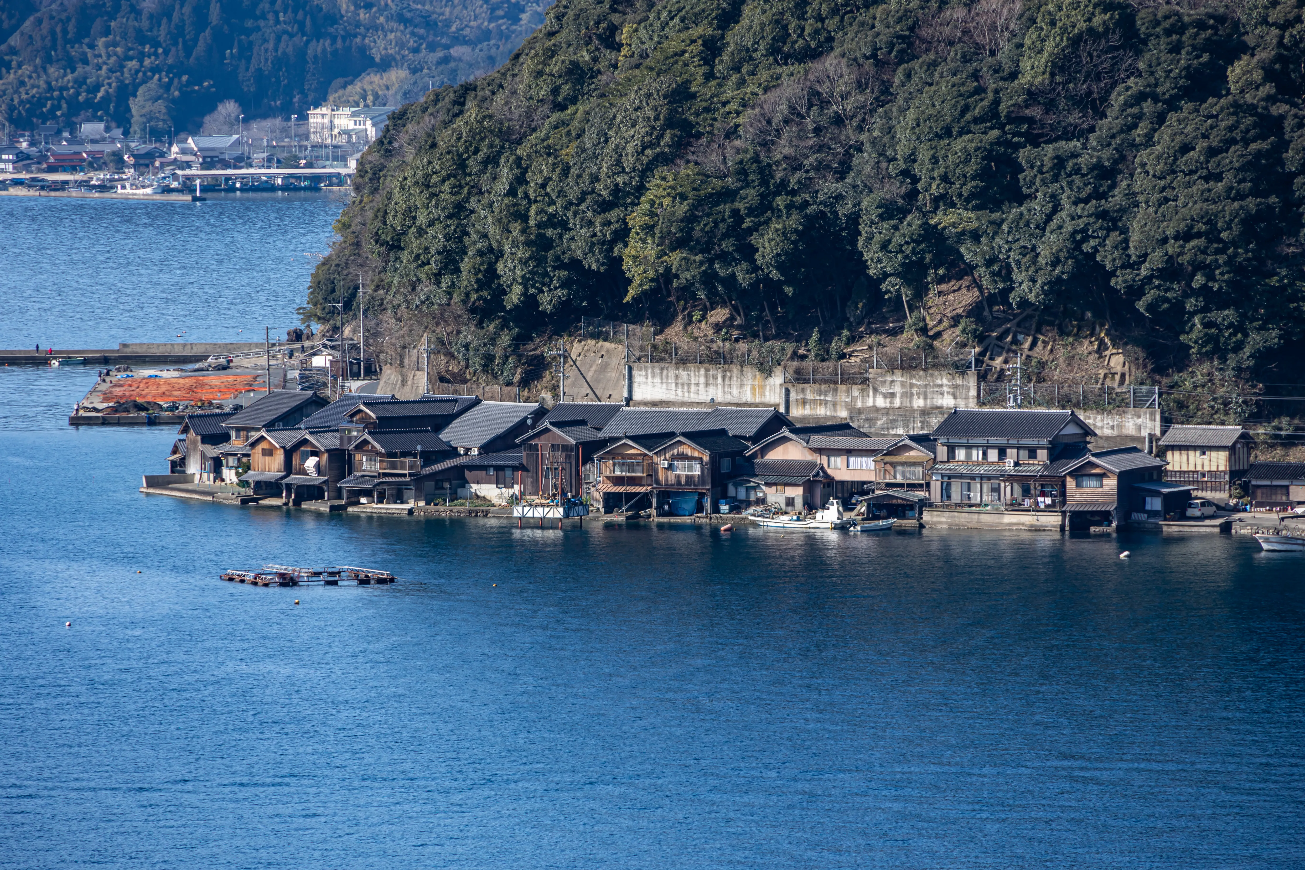 The funaya boathouses of Ine lining the bay under clear February light